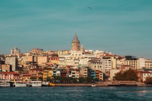 Beautiful view of Galata Tower and vibrant Istanbul skyline by the Bosphorus.