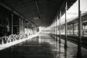 Black and white view of historic Sirkeci train station platform in Istanbul.