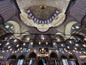 Stunning interior view of the Blue Mosque showcasing its intricate domes and arches.