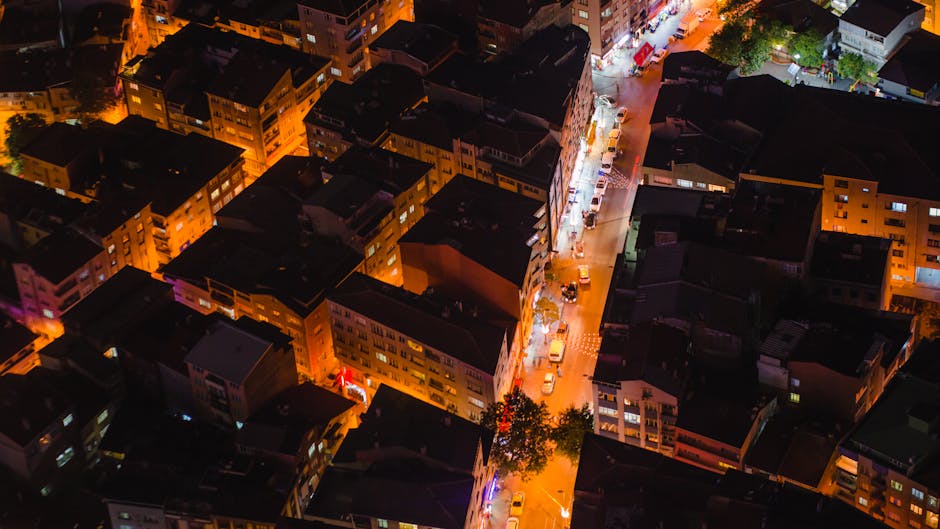 A vibrant aerial view of illuminated Istanbul streets and rooftops at night.
